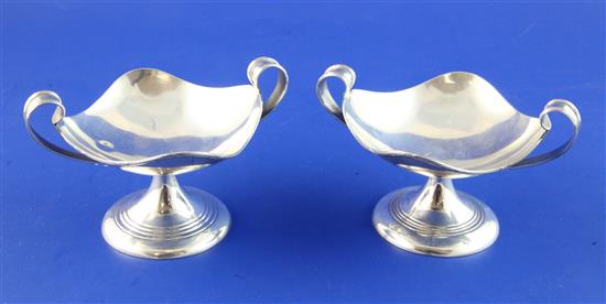 A stylish pair of George V silver two handled pedestal bon bon dishes, 5 oz.